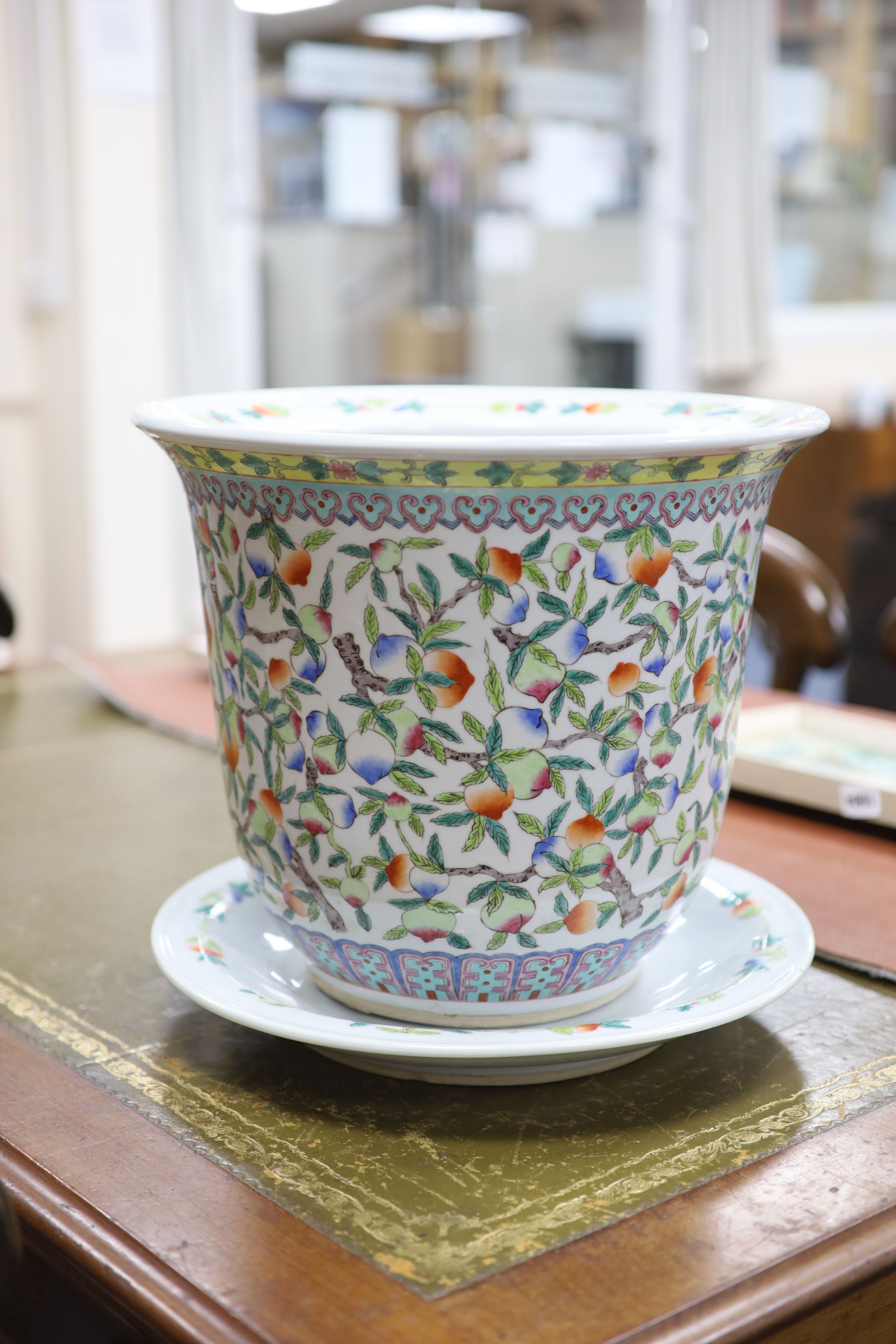 A 20th century Chinese porcelain jardiniere and dish, diameter 36 cms.